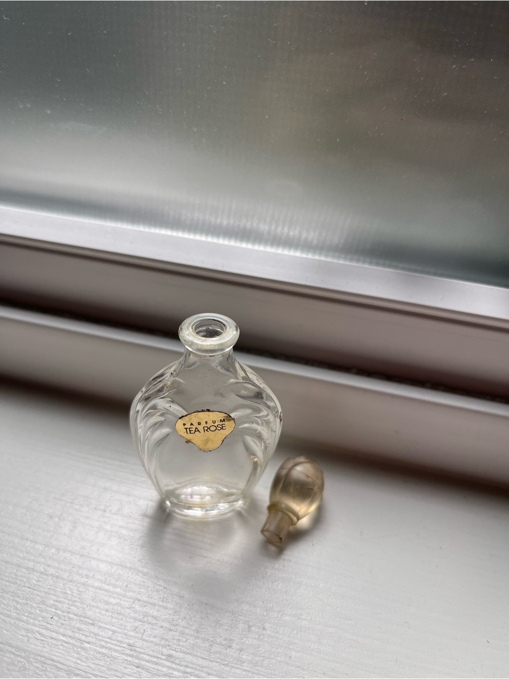 Tea rose perfume bottle.